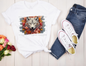 image of a short sleeve, white, graphic tee with 3d flowers and a wolf