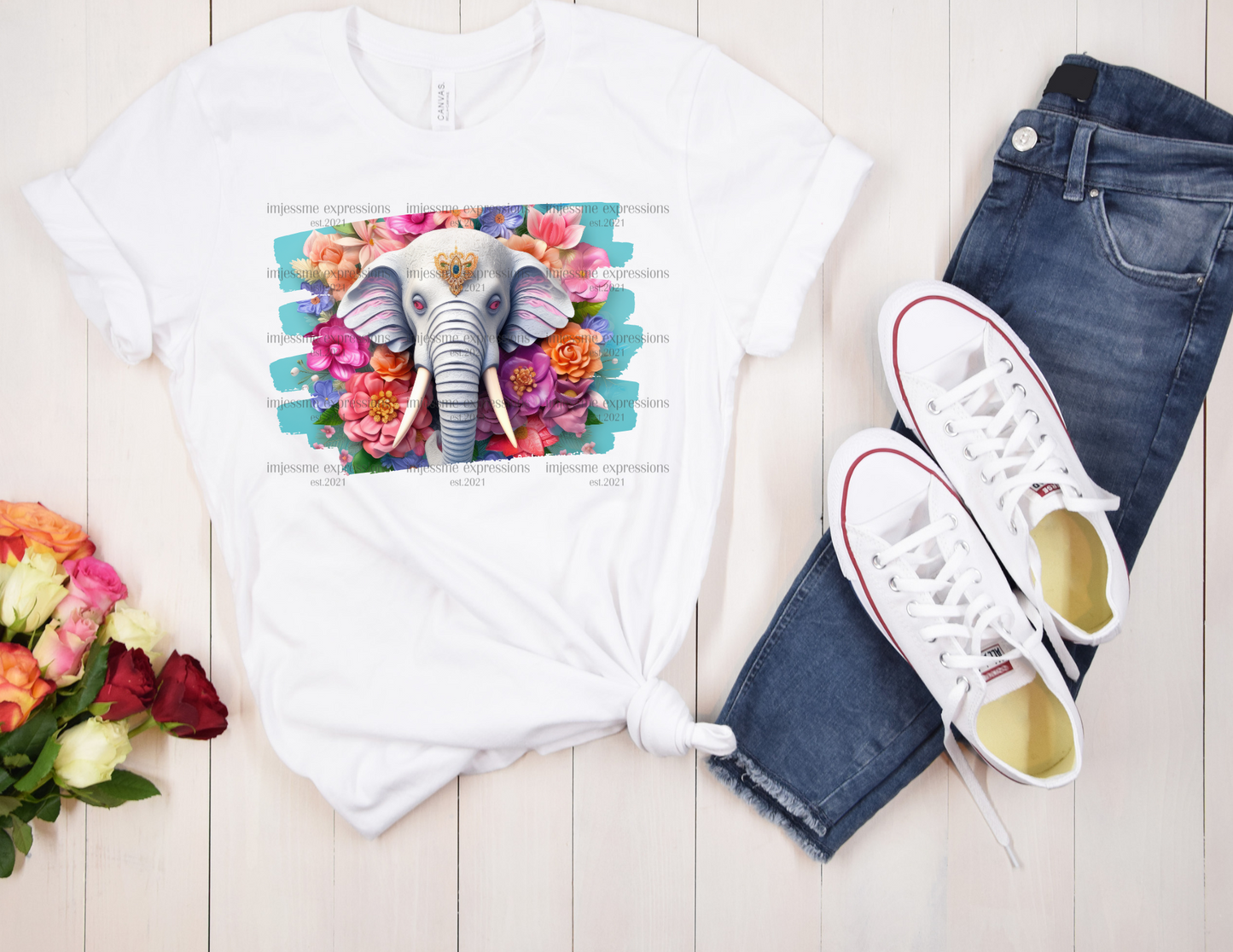 image of a short sleeve, white, graphic tee, with 3d flowers and an elephant